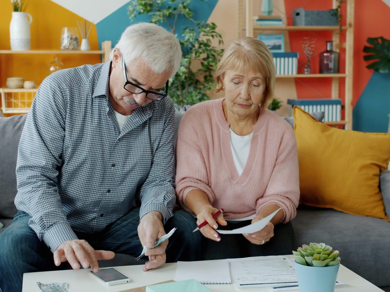Couple reviewing documents together at home