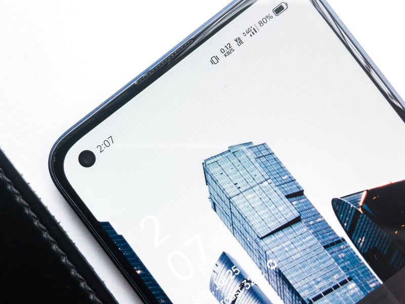 Smartphone with lock screen showing city skyline — mobile-first payment apps